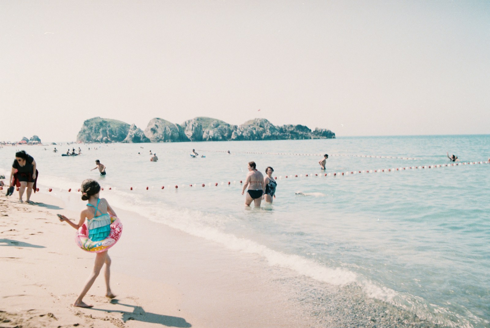 People enjoying a sunny day at the beach.