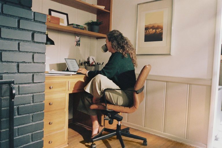 Woman working at desk with coffee